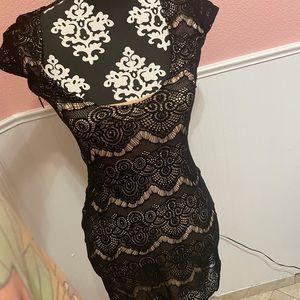 Bebe dress, only worn once. Black lace with nude fabric underneath.
